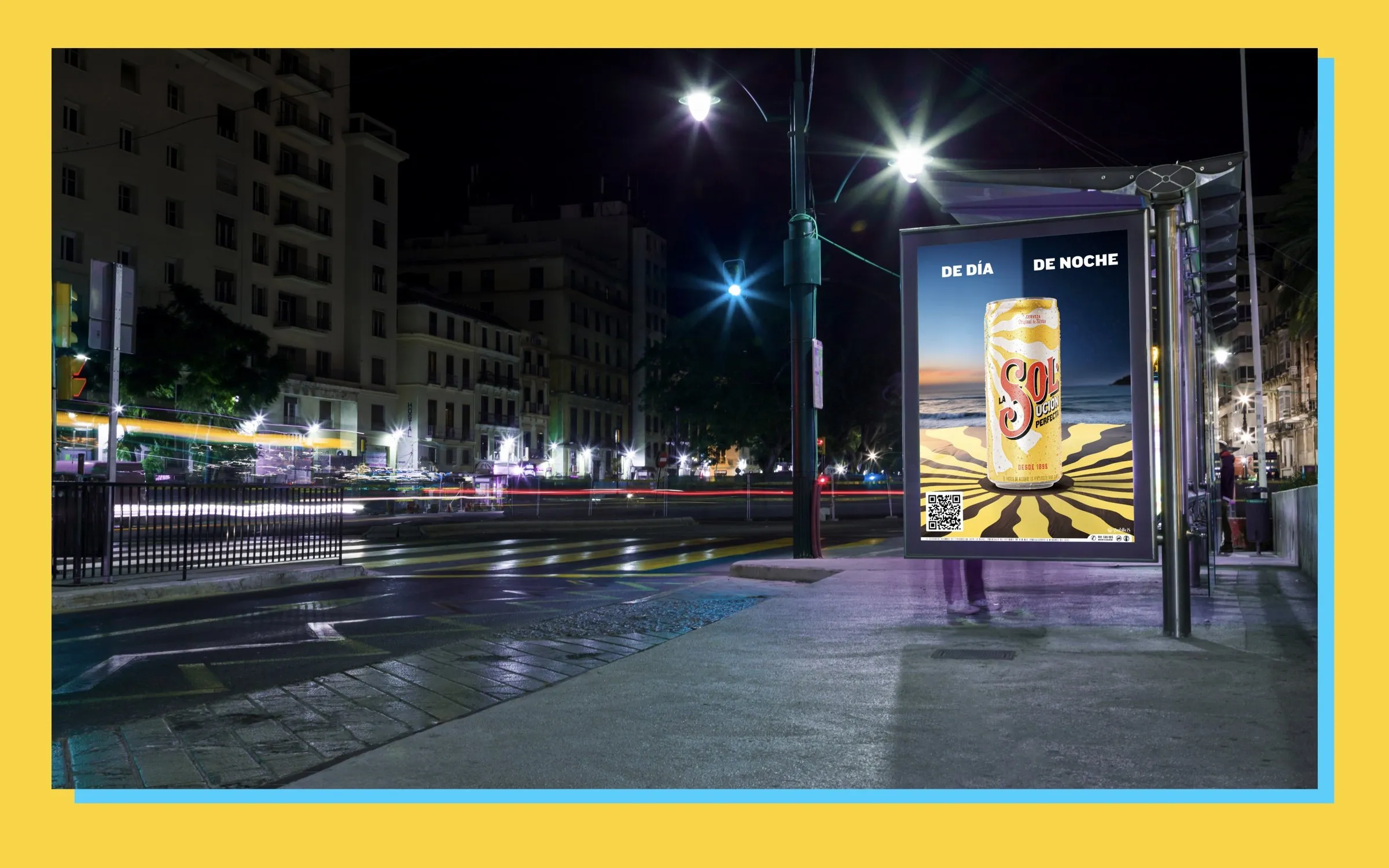 Cerveza Sol poster in a bus shelter at night